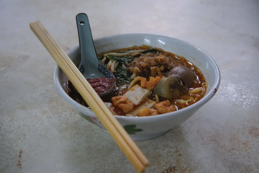 soup noodle with meat and egg toppings served in a bowl