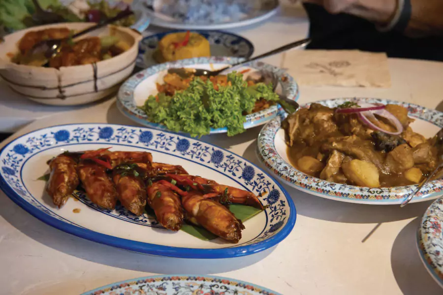 dishes served on plates with traditional designs